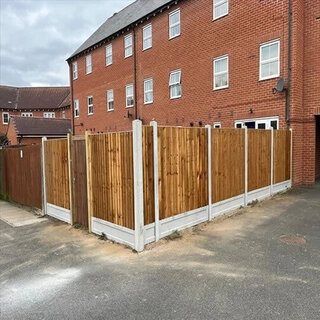 Closeboard fence with concrete posts and gravelboards