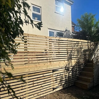 Decking with integrated fencing and steps