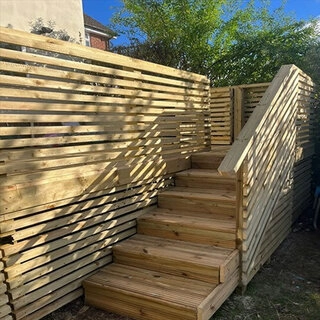 Decking with integrated fencing and steps